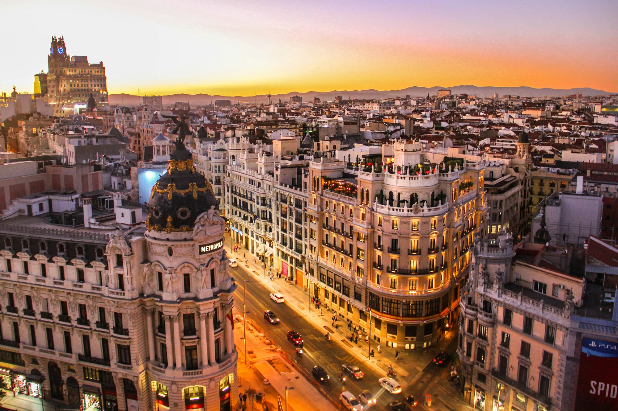 Madrid's Gran Vía and the Metropolis building at sunset