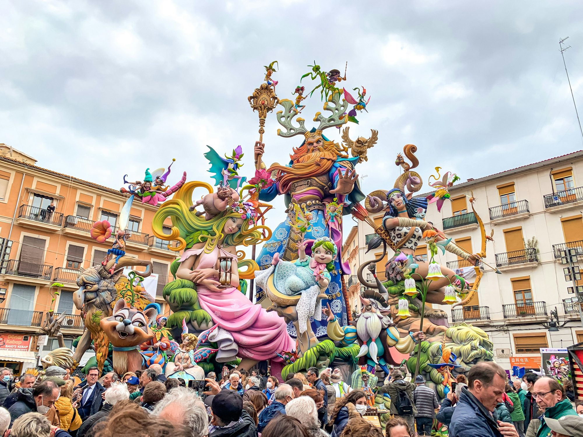 A Falla float towering over a crowd in Valencia