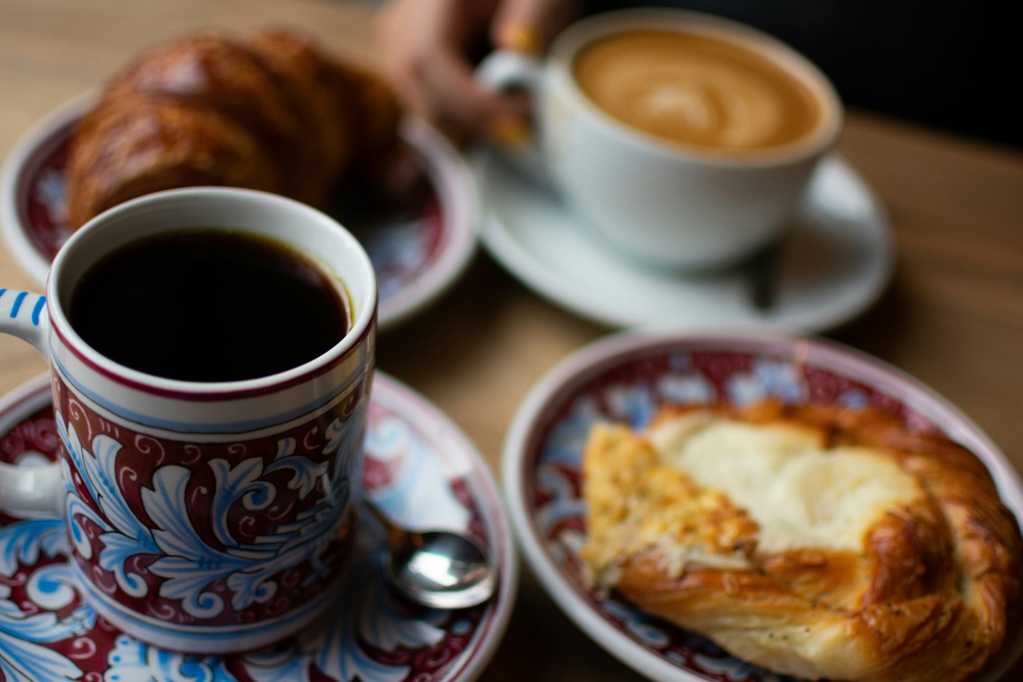 Coffee and pastries on a Spanish-tiled saucer